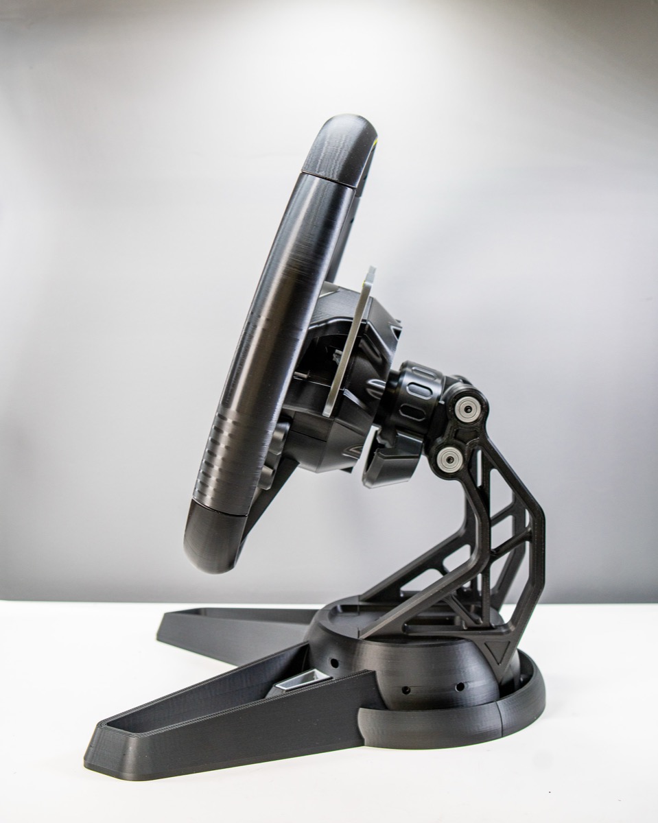 Steering wheel stand — side profile showing tilt mechanism